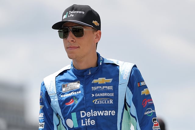Carson Hocevar, driver of the #7 Delaware Life Chevrolet, walks the grid during qualifying for the NASCAR Craftsman Truck Series MillerTech Battery 200 at Pocono Raceway on June 20, 2025 in Long Pond, Pennsylvania.