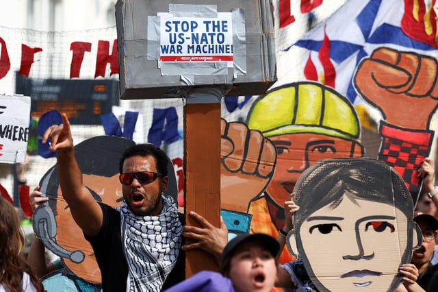 A demonstrator reacts, during a march against the upcoming NATO leaders' summit, at The Hague, Netherlands June 22, 2025. REUTERS/Piroschka van de Wouw