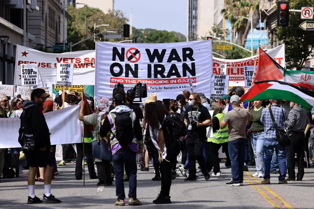 A "No war on Iran" banner is held as people attend an anti-war demonstration in Los Angeles, California, U.S., June 21, 2025. REUTERS/David Swanson/File Photo