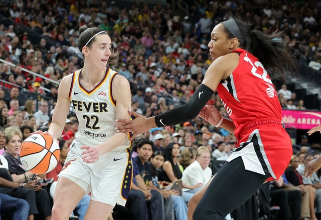 Caitlin Clark #22 of the Indiana Fever is guarded by A&#39;ja Wilson #22 of the Las Vegas Aces in the first quarter of their game at T-Mobile Arena on July 02, 2024, in Las Vegas, Nevada. The Aces defeated the Fever 88-69.