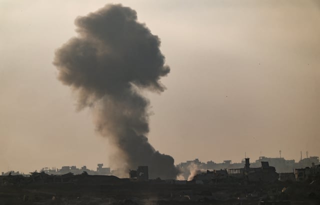Smoke rises from Gaza after an explosion, as seen from the Israeli side of the border, June 11, 2025. REUTERS/Amir Cohen/File Photo