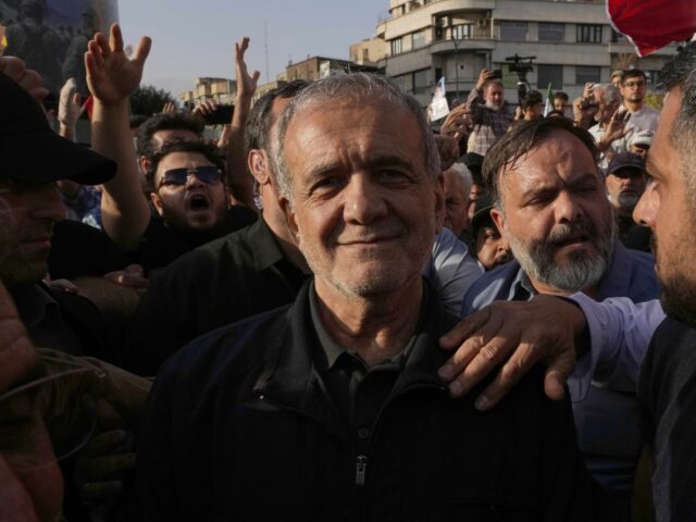 Iranian President Masoud Pezeshkian attends a protest following the U.S. attacks on nuclear sites in Iran, in Tehran, Iran, Sunday, June 22, 2025. (AP Photo/Vahid Salemi)