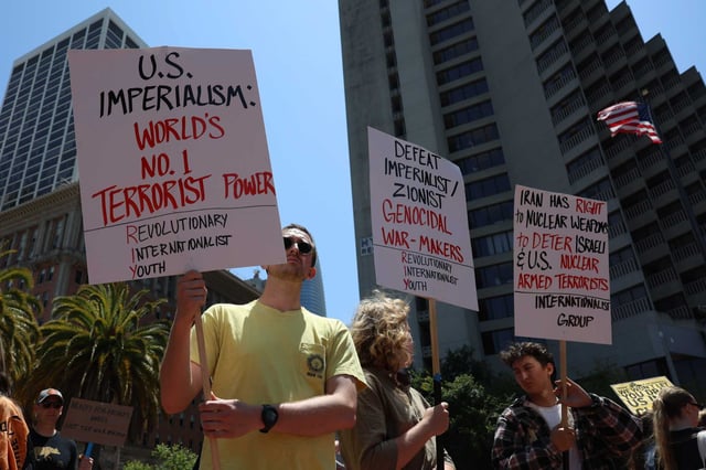 Demonstrators protest President Donald Trump’s decision to bomb Iranian nuclear facilities during a rally Sunday at Embarcadero Plaza in San Francisco.