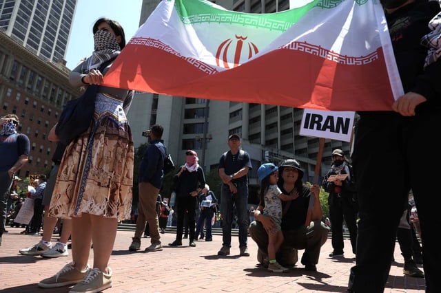 Demonstrators protest President Donald Trump’s decision to bomb Iranian nuclear facilities during a rally Sunday at Embarcadero Plaza in San Francisco.