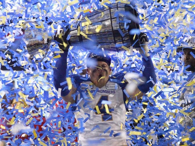 Then-Winnipeg Blue Bomber linebacker Adam Bighill celebrates with the Grey Cup after the 107th Grey Cup CFL Championship in Calgary at McMahon Stadium on Sunday, Nov. 24, 2019.