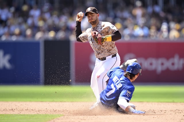 SAN DIEGO, CALIFORNIA – JUNE 22: Jose Iglesias #7 of the San Diego Padres throws to first base after forcing out Bobby Witt Jr. #7 of the Kansas City Royals at second base to complete a double play during the eighth inning at Petco Park on June 22, 2025 in San Diego, California. (Photo by Orlando Ramirez/Getty Images)