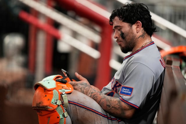 New York Mets catcher Francisco Alvarez (4) in the dugout after a loss to the Atlanta Braves after a baseball game, Tuesday, June 17, 2025, in Atlanta. (AP Photo/Brynn Anderson)