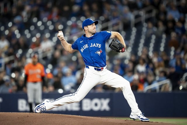 Toronto Blue Jays pitcher Max Scherzer (31) pitches the ball during first inning MLB baseball action against the Baltimore Orioles, in Toronto on Saturday, March 29, 2025. THE CANADIAN PRESS/Christopher Katsarov