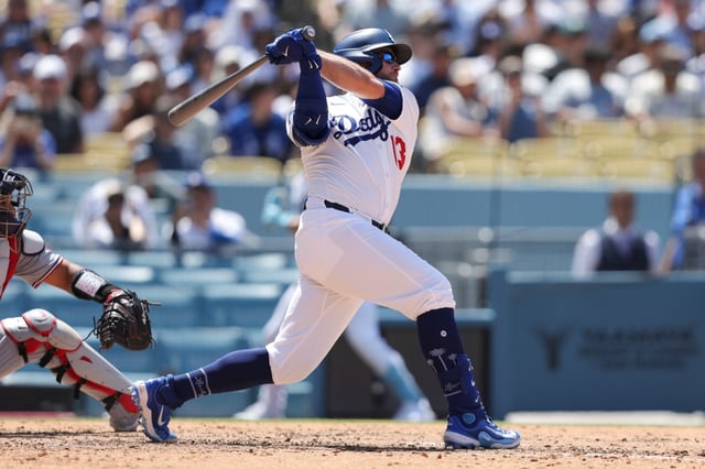 Dodgers’ Max Muncy follows through on a grand slam during the sixth inning of a baseball game against the Washington Nationals in Los Angeles, Sunday, June 22, 2025. (AP Photo/Jessie Alcheh)