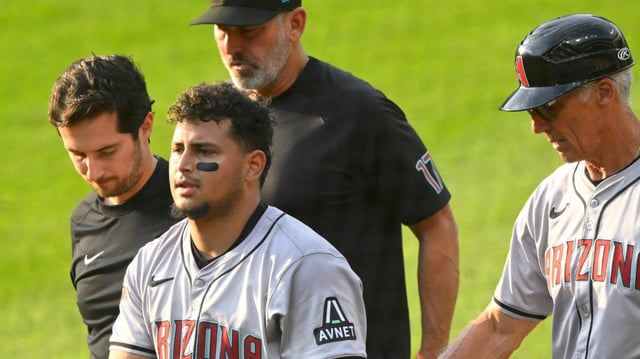 Arizona Diamondbacks catcher Gabriel Moreno (14) walks to the dugout with an apparent injury in the second inning against the Cleveland Guardians at Progressive Field.