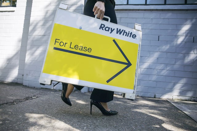 An agent carries a &#39;For Lease&#39; sign outside a property inspection for potential tenants in Sydney, Australia, on Saturday, August 12, 2023. Less than 1% of Australia&#39;s rental properties are now available for occupancy, sending rents soaring, deepening the cost-of-living crunch, and pushing thousands more Australians into homelessness. Photographer: Brent Lewin/Bloomberg via Getty Images