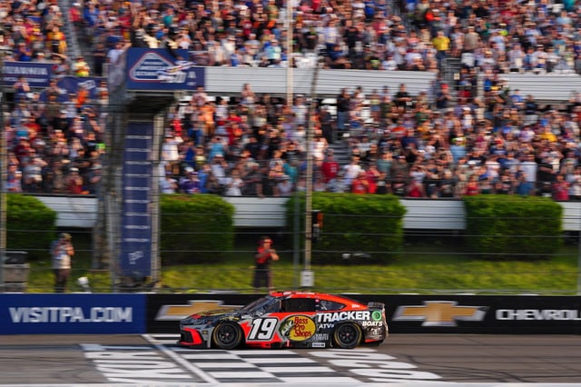 Chase Briscoe crosses the finish line to win a NASCAR Cup Series auto race at Pocono Raceway, Sunday, June 22, 2025, in Long Pond, Pa. (AP Photo/Derik Hamilton)