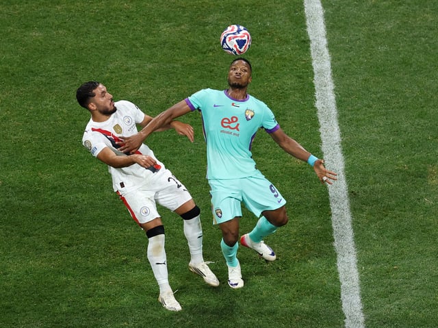 Soccer Football - FIFA Club World Cup - Group G - Manchester City v Al Ain - Mercedes-Benz Stadium, Atlanta, Georgia, U.S. - June 22, 2025 Al Ain's Kodjo Fo-Doh Laba in action with Manchester City's Rayan Cherki REUTERS/Amanda Perobelli