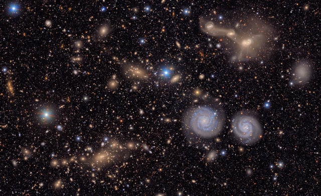 This image shows another small section of NSF-DOE Vera C. Rubin Observatory's total view of the Virgo cluster. Visible are two prominent spiral galaxies (lower right), three merging galaxies (upper right), several groups of distant galaxies, many stars in the Milky Way galaxy and more.