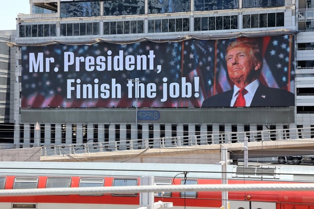 A billboard in Tel Aviv conveys a message addressed to Donald Trump prior to Washington’s decision to target Iran’s most heavily-protected nuclear facilities. (Photo: Gil COhen-Magen / AFP)