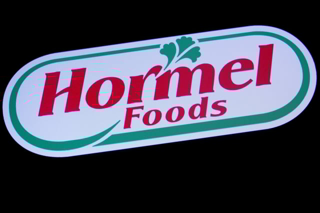 The company logo for Hormel Foods is displayed on a screen on the floor at the New York Stock Exchange (NYSE) in New York, U.S., October 9, 2019. REUTERS/Brendan McDermid/File Photo