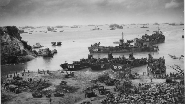 American landing craft arrive on the beaches of Okinawa on April 13, 1945.