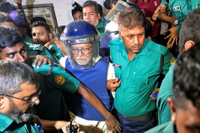 Bangladesh's former elections chief KM Nurul Huda (C) has been remanded for questioning over his alleged role in rigging votes to favour ousted premier Sheikh Hasina
