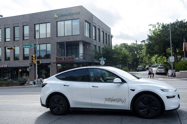 A Tesla robotaxi drives on the street along South Congress Avenue in Austin, Texas, U.S., June 22, 2025. REUTERS/Joel Angel Juarez