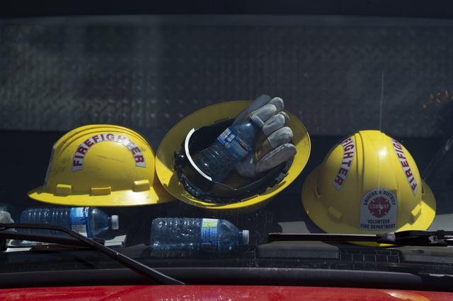 Firefighters' helmets and water bottles rest against the windshield of a truck at a command centre in Tantallon, N.S. outside of Halifax on Wednesday, May 31, 2023. THE CANADIAN PRESS/Darren Calabrese