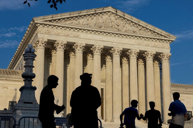 People gather outside the U.S. Supreme Court in Washington, U.S., June 29, 2024. REUTERS/Kevin Mohatt/File Photo