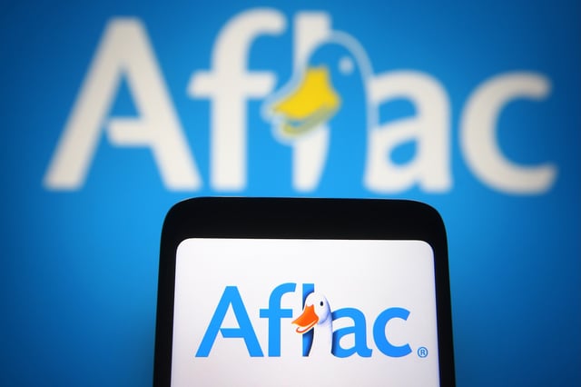 UKRAINE - 2021/05/21: In this photo illustration the Aflac logo of an US insurance company is seen on a smartphone and a pc screen. (Photo Illustration by Pavlo Gonchar/SOPA Images/LightRocket via Getty Images)