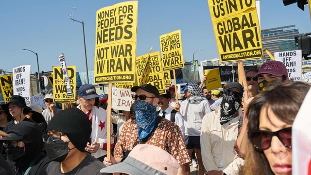 People protest against the US and Israeli strikes on Iran, ICE immigration raids, and in support of Palestinians during a demonstration outside the Westwood Federal Building in the Westwood neighborhood of Los Angeles on June 22, 2025.