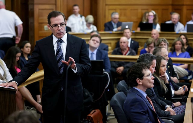 Prosecutor Hank Brennan, left, speaks to jurors during closing arguments in the murder trial of Karen Read in Norfolk Superior Court, Friday, June 13, 2025, in Dedham, Mass. (Mark Stockwell/The Sun Chronicle via AP, Pool) 