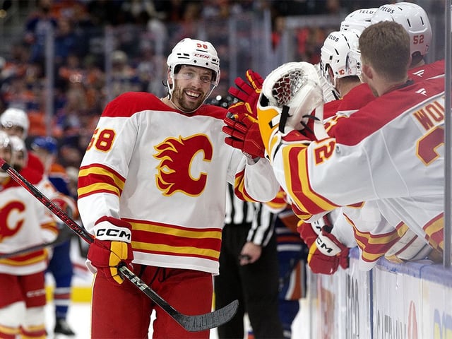 The Calgary Flames' Justin Kirkland (58) celebrates a goal against the Edmonton Oilers during third-period NHL action at Rogers Place in Edmonton on Sunday, Oct. 13, 2024. Calgary won 4-1.