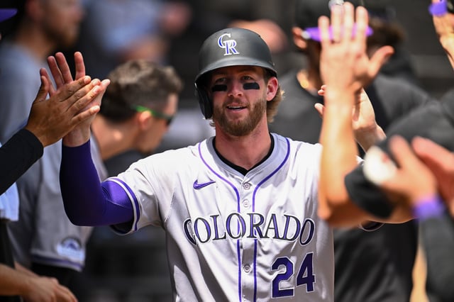 CHICAGO, ILLINOIS - JUNE 30: Ryan McMahon #24 of the Colorado Rockies celebrates in the dugout after scoring in the second inning from a balk from Garrett Crochet of the Chicago White Sox at Guaranteed Rate Field on June 30, 2024 in Chicago, Illinois.