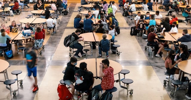 Students eat lunch in the cafeteria at Chapa Middle School in Kyle on Aug. 24, 2021.