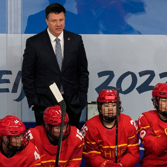 China head coach Brian Idalski watches from the bench during a preliminary round women's hockey game against Czech Republic at the 2022 Winter Olympics in Beijing on February 3, 2022. THE CANADIAN PRESS/AP, Petr David Josek