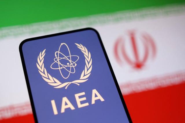 International Atomic Energy Agency (IAEA) logo and Iranian flag is seen in this illustration taken June 16, 2025. REUTERS/Dado Ruvic/Illustration