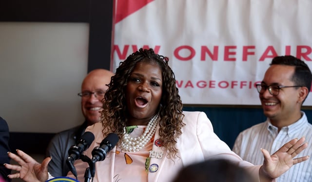 Cook County Commissioner Tara Stamps speaks alongside other elected officials at a One Fair Wage rally at the TNT Rooftop Restaurant in Chicago, June 23, 2025. (Antonio Perez/Chicago Tribune)