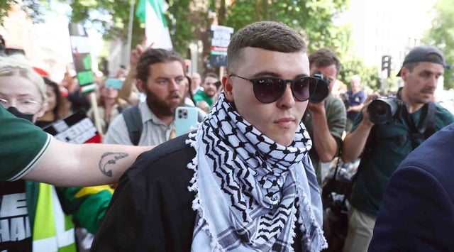 Liam Óg Ó hAnnaidh, who performs under the name Mo Chara of the Irish group Kneecap, is seen departing Westminster Magistrates' Court in London, England, on June 18, 2025. (Peter Nicholls/Getty Images)