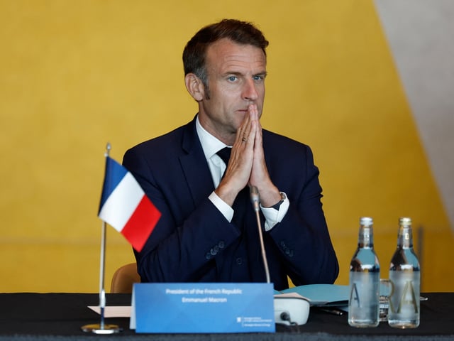 French President Emmanuel Macron gestures a reception at The National Museum in Oslo, Norway, on June 23, 2025. French President Emmanuel Macron visits the Kingdom of Norway on June 23 and June 24, 2025, the first visit by a French head of state to Norway since 1984. The visit will underline France's ongoing commitment to the Nordic and Arctic region, particularly in terms of security. The trip will also provide an opportunity to reaffirm Europe's position on the conflicts in Ukraine and the Near and Middle East. (Photo by Odd ANDERSEN / AFP) (Photo by ODD ANDERSEN/AFP via Getty Images)