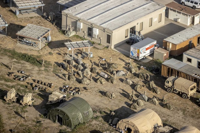 Service members with the California Army National Guard, part of a deployment by President Donald Trump to Los Angeles in response to the protests against Federal immigration raids, are seen at Joint Forces Training Base Los Alamitos in Los Alamitos on June 20, 2025.