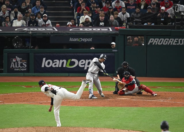 CLEVELAND, OHIO - OCTOBER 18: Juan Soto #22 of the New York Yankees swings at a pitch by Emmanuel Clase #48 of the Cleveland Guardians in the ninth inning during Game Four of the American League Championship Series at Progressive Field on October 18, 2024 in Cleveland, Ohio.