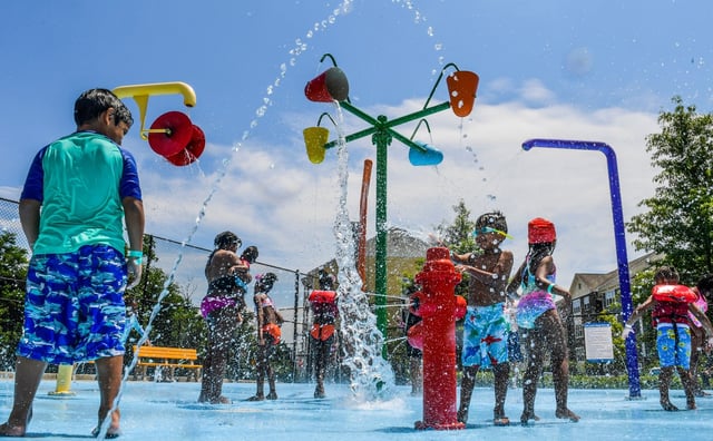 The splash pad is a popular destination for kids as they cool off on a hot Saturday afternoon at the Roger Carter Community Center and pool in Ellicott City.
