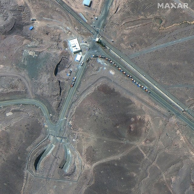 A satellite picture taken on Thursday shows trucks positioned near the entrance of Iran's uranium-enrichment site, northeast of the city of Qom.