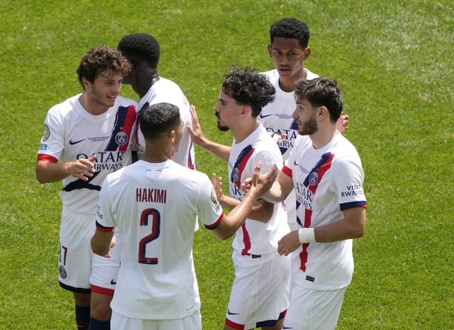 Soccer Football - FIFA Club World Cup - Group B - Seattle Sounders v Paris St Germain - Lumen Field, Seattle, Washington, U.S. - June 23, 2025 Paris St Germain's Khvicha Kvaratskhelia celebrates scoring their first goal with teammates IMAGN IMAGES via Reuters/Stephen Brashear