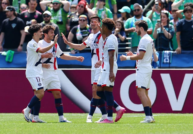 Soccer Football - FIFA Club World Cup - Group B - Seattle Sounders v Paris St Germain - Lumen Field, Seattle, Washington, U.S. - June 23, 2025 Paris St Germain's Khvicha Kvaratskhelia celebrates scoring their first goal with teammates REUTERS/Agustin Marcarian