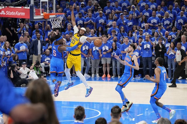 Jun 22, 2025; Oklahoma City, Oklahoma, USA; Oklahoma City Thunder guard Luguentz Dort (5) passes the ball againstIndiana Pacers center Myles Turner (33) during game seven of the 2025 NBA Finals at Paycom Center. Mandatory Credit: Kyle Terada-Imagn Images