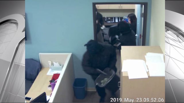 A photo shows masked bank robbers at San Diego County Credit Union in Escondido in Oct. 2019. 