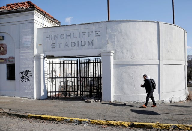 In this March 14, 2013, file photo, a man walks past an entrance to Hinchliffe Stadium in Paterson, N.J., prior to the stadium&#39;s renovation. (AP Photo/Mel Evans, File)