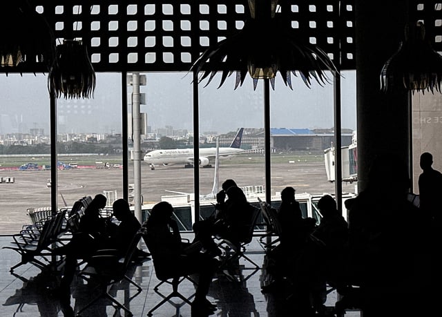 People wait to board their flight at the Chhatrapati Shivaji Maharaj International Airport in Mumbai, India, May 30, 2025. REUTERS/Francis Mascarenhas/File Photo