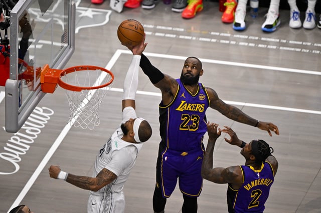 Apr 9, 2025; Dallas, Texas, USA; Dallas Mavericks center Daniel Gafford (21) and Los Angeles Lakers forward LeBron James (23) battle for the rebound during the first quarter at the American Airlines Center. Mandatory Credit: Jerome Miron-Imagn Images/File Photo
