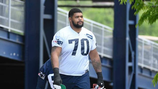 May 23, 2022; Foxborough, MA, USA; New England Patriots offensive tackle Yasir Durant (70) walks to the practice field for the team’s OTA at Gillette Stadium. Mandatory Credit: Eric Canha-Imagn Images