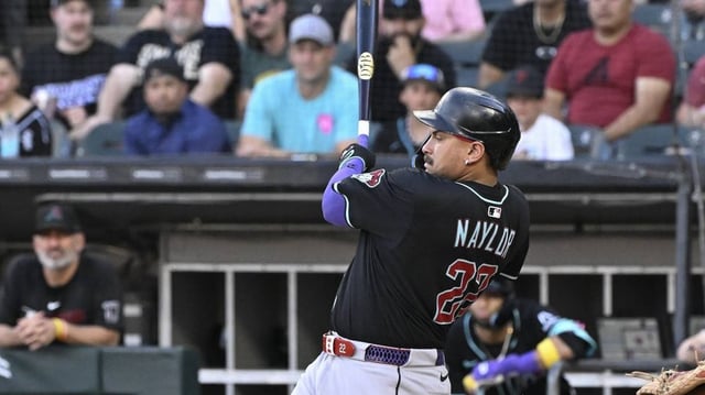 Jun 23, 2025; Chicago, Illinois, USA;  Arizona Diamondbacks first base Josh Naylor (22) hits a two run double during the first inning against the Chicago White Sox at Rate Field. Mandatory Credit: Matt Marton-Imagn Images