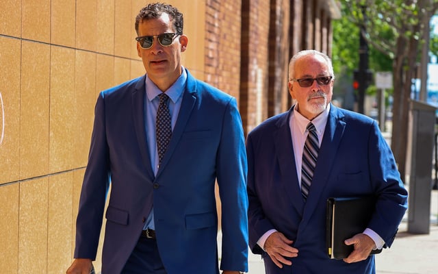 Leo Govoni, right, the Clearwater, Fla. businessperson accused of taking $100 million from medical trust funds, leaves federal court with his attorney Paul Sisco after an April bankruptcy hearing. Govoni was indicted Monday. (Dirk Shadd/Tampa Bay Times/TNS)